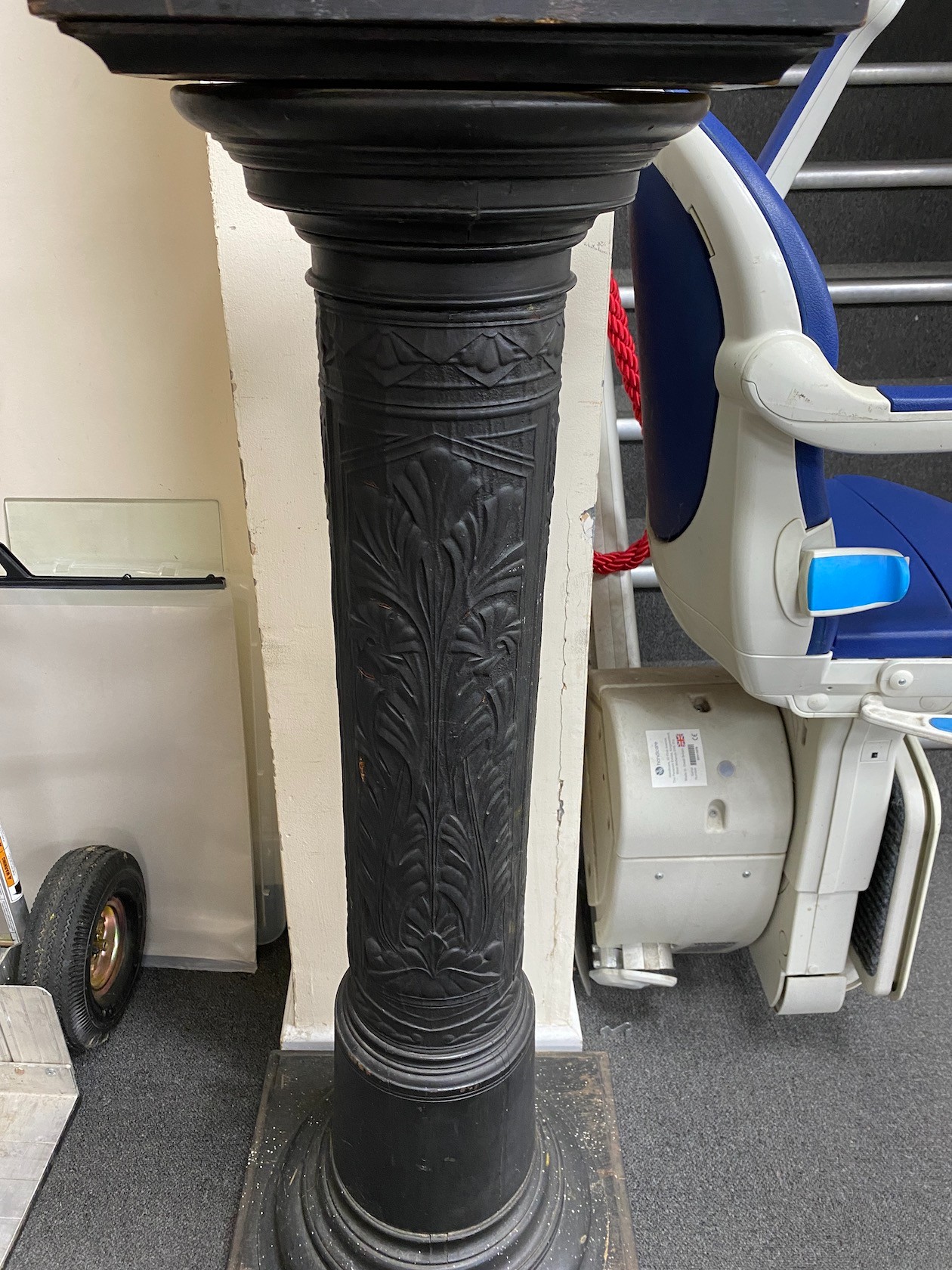 An ebonized and embossed leather covered pedestal, height 114cm.